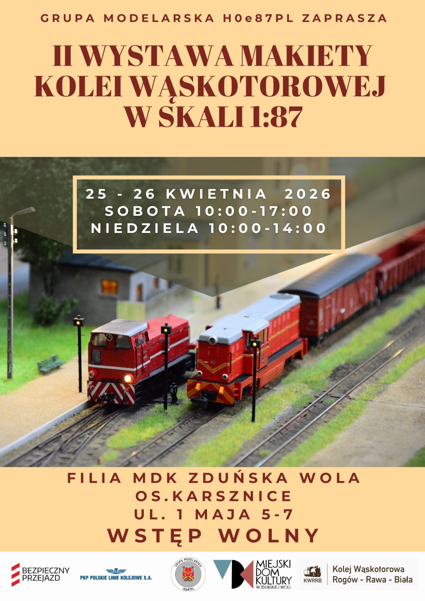na plakacie dwa pociągi, długie czerwone z informacja o wystawie makiet w Karsznicach