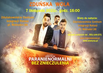 Friends screaming and laughing while riding roller coaster at amusement park